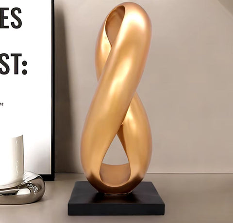 Sculpture abstraite dorée en résine 38 cm