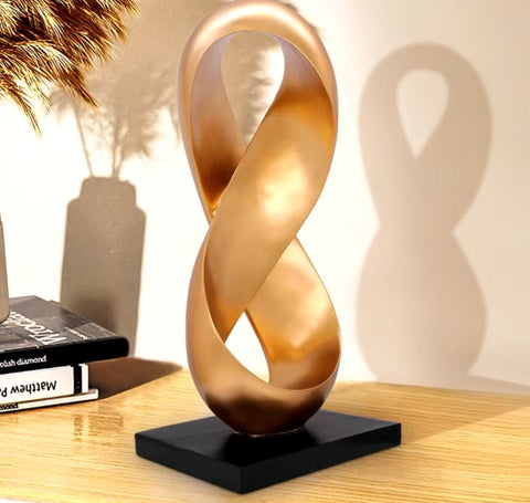 Sculpture abstraite dorée en résine 38 cm