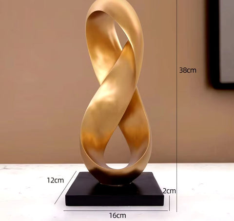 Sculpture abstraite dorée en résine 38 cm