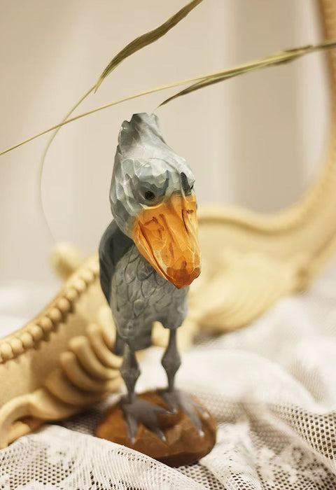 Statue oiseau cigogne à tête de baleine en bois 16 cm